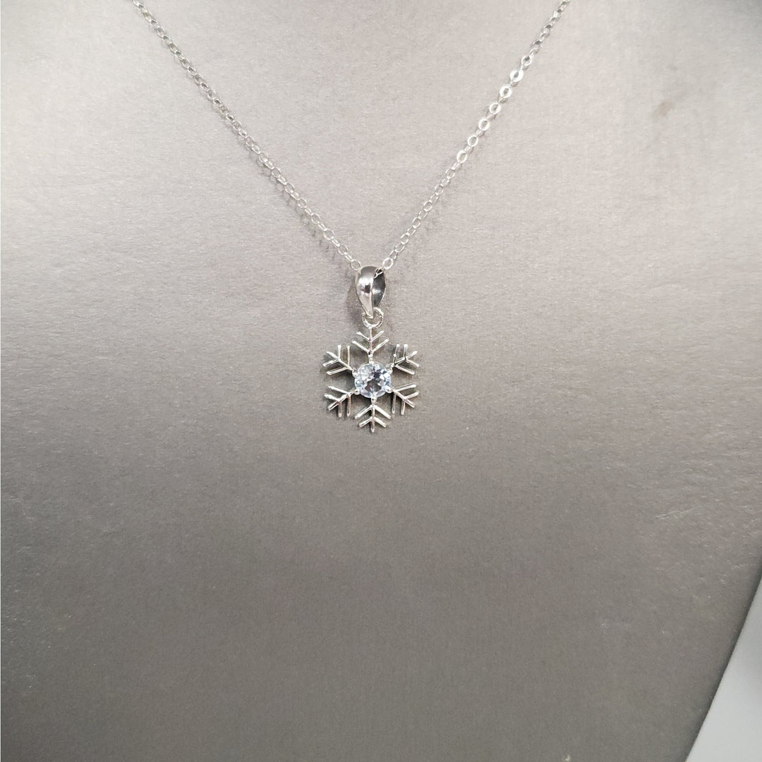Sterling Silver Snowflake Pendant Necklace With Natural Blue Topaz