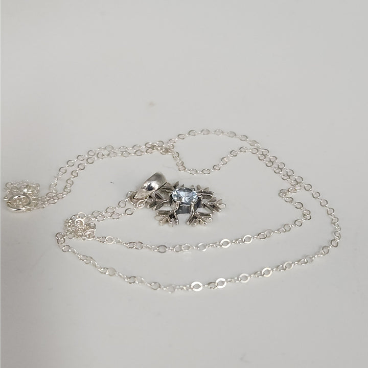 Sterling Silver Snowflake Pendant Necklace With Natural Blue Topaz