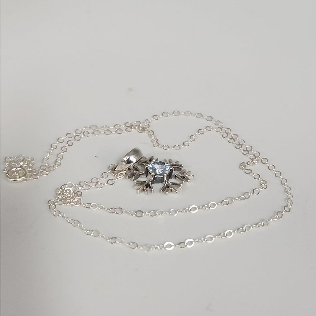 Sterling Silver Snowflake Pendant Necklace With Natural Blue Topaz