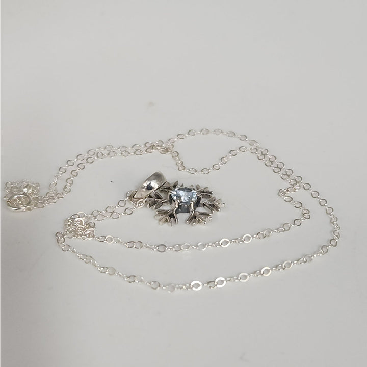 Sterling Silver Snowflake Pendant Necklace With Natural Blue Topaz