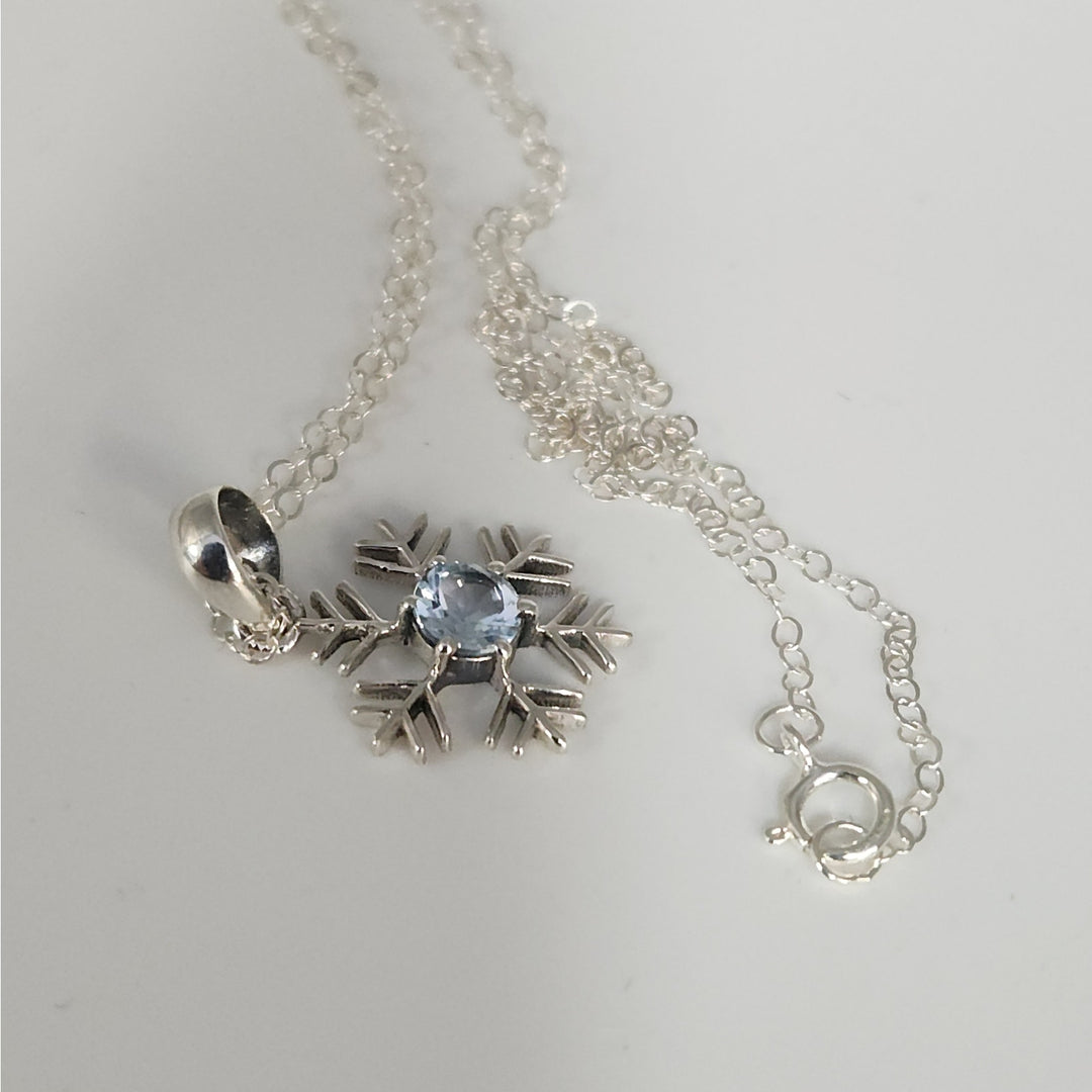 Sterling Silver Snowflake Pendant Necklace With Natural Blue Topaz