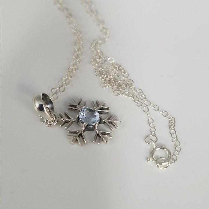 Sterling Silver Snowflake Pendant Necklace With Natural Blue Topaz
