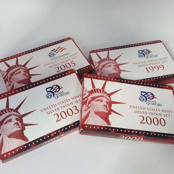 Collection Of 1999, 2000, 2003 And 2005 United States Mint Sliver Proof Set