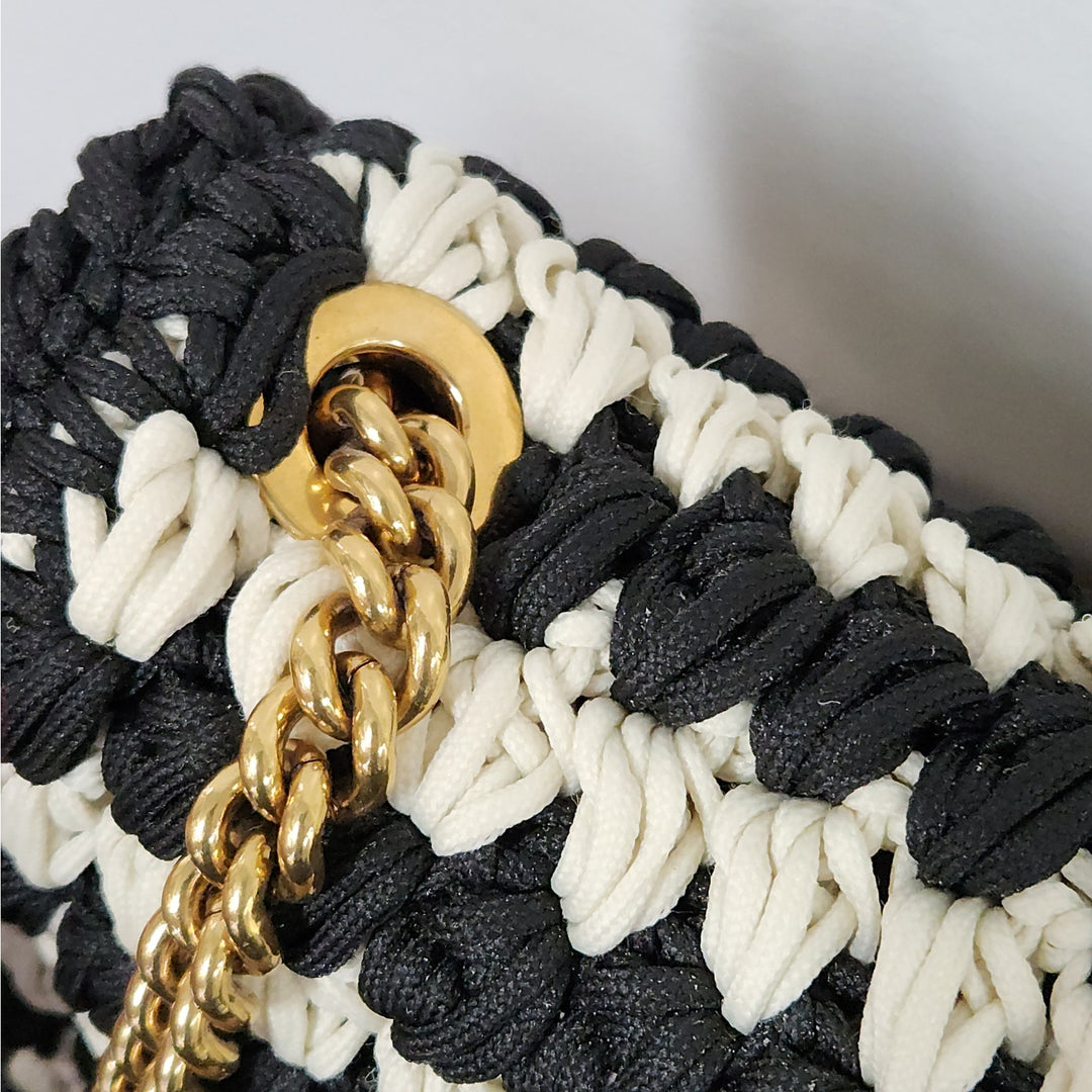 Ferragamo black & white handwoven shoulder bag  gold chain strap signature bow