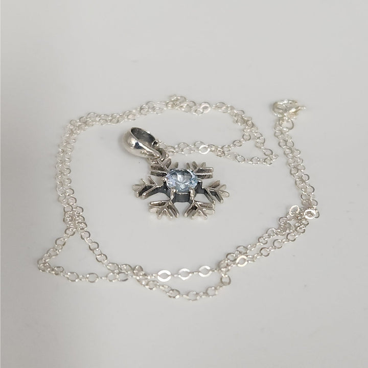 Sterling Silver Snowflake Pendant Necklace With Natural Blue Topaz