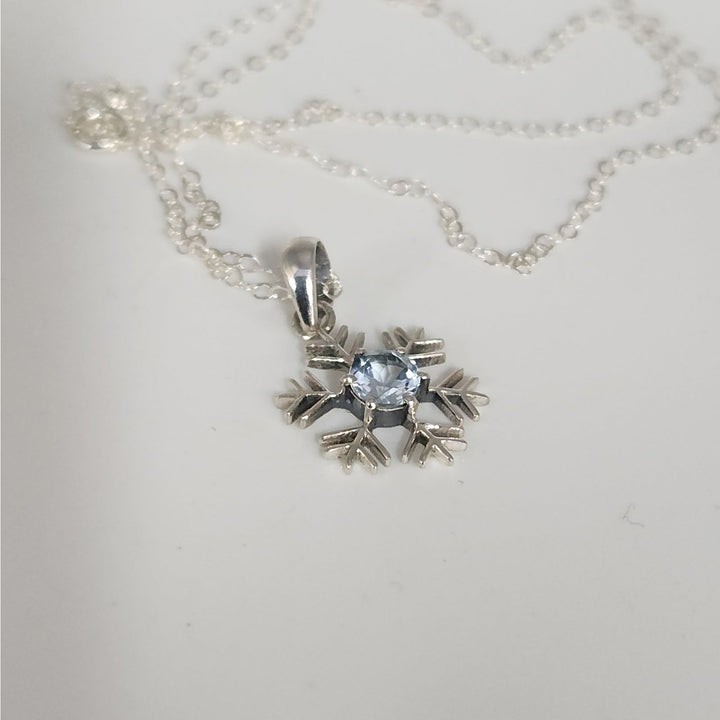 Sterling Silver Snowflake Pendant Necklace With Natural Blue Topaz