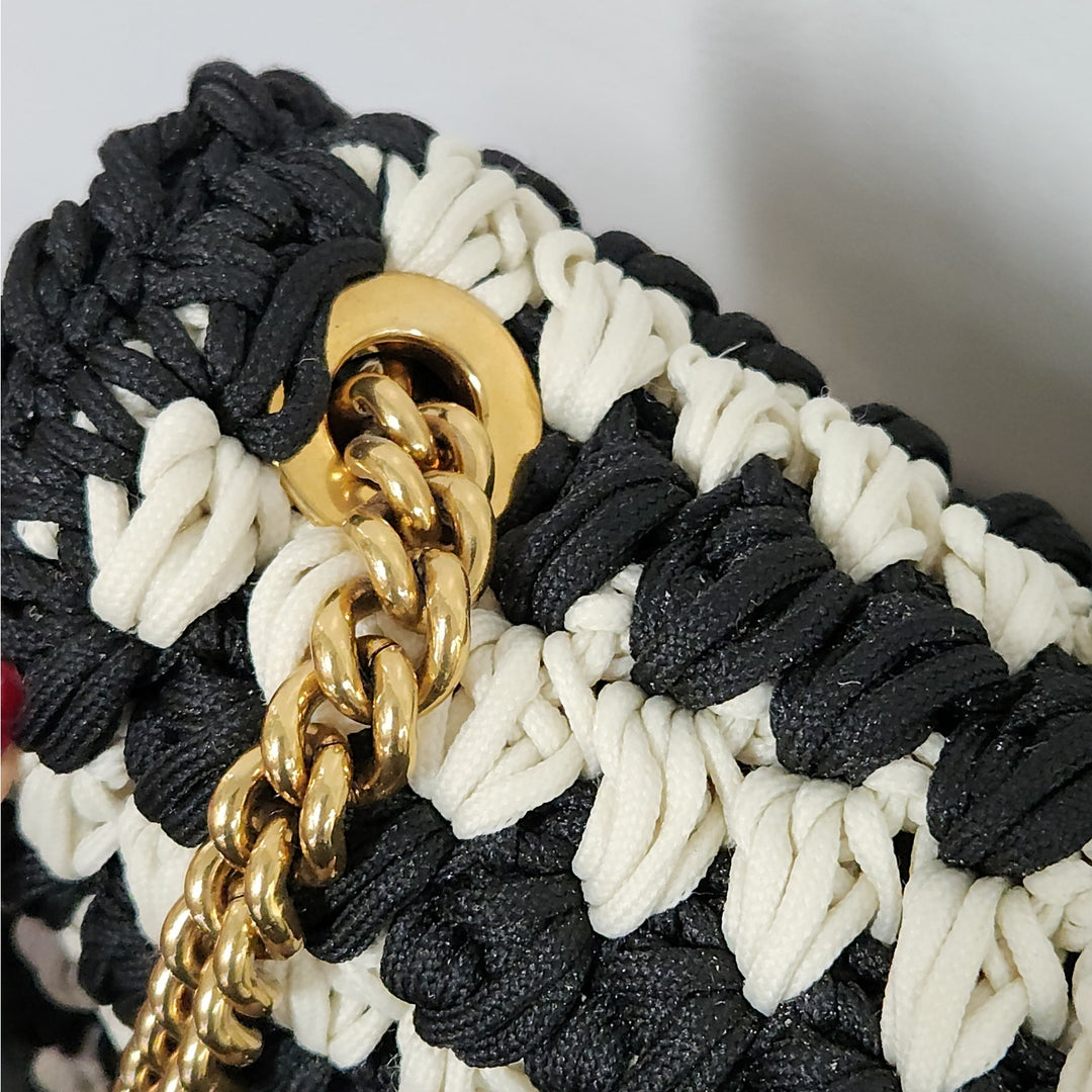 Ferragamo black & white handwoven shoulder bag  gold chain strap signature bow