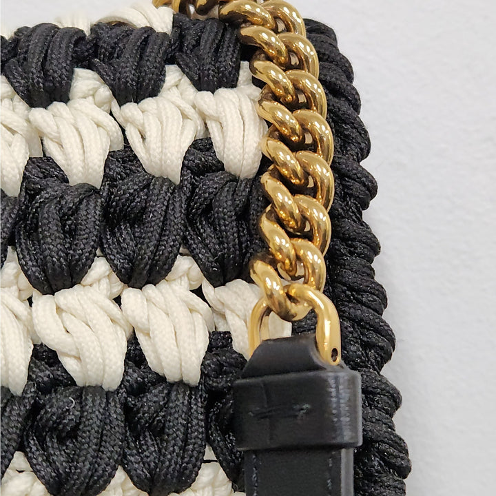 Ferragamo black & white handwoven shoulder bag  gold chain strap signature bow